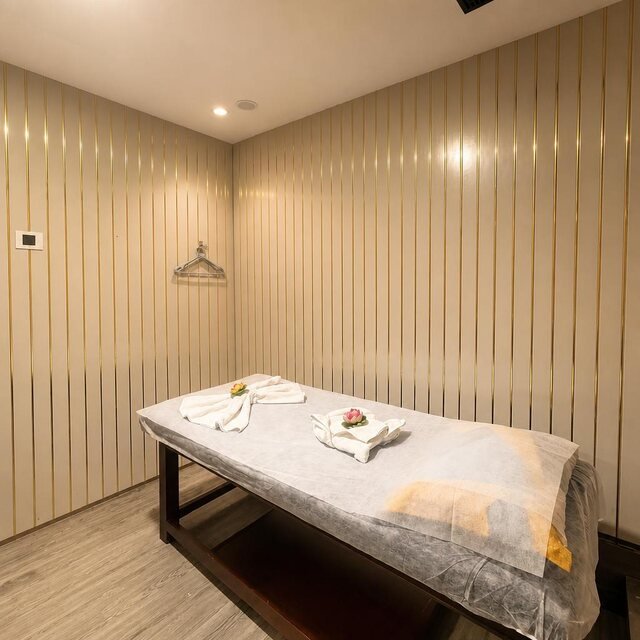 Prepared massage bed in a treatment room at The Thai Wellness Spa